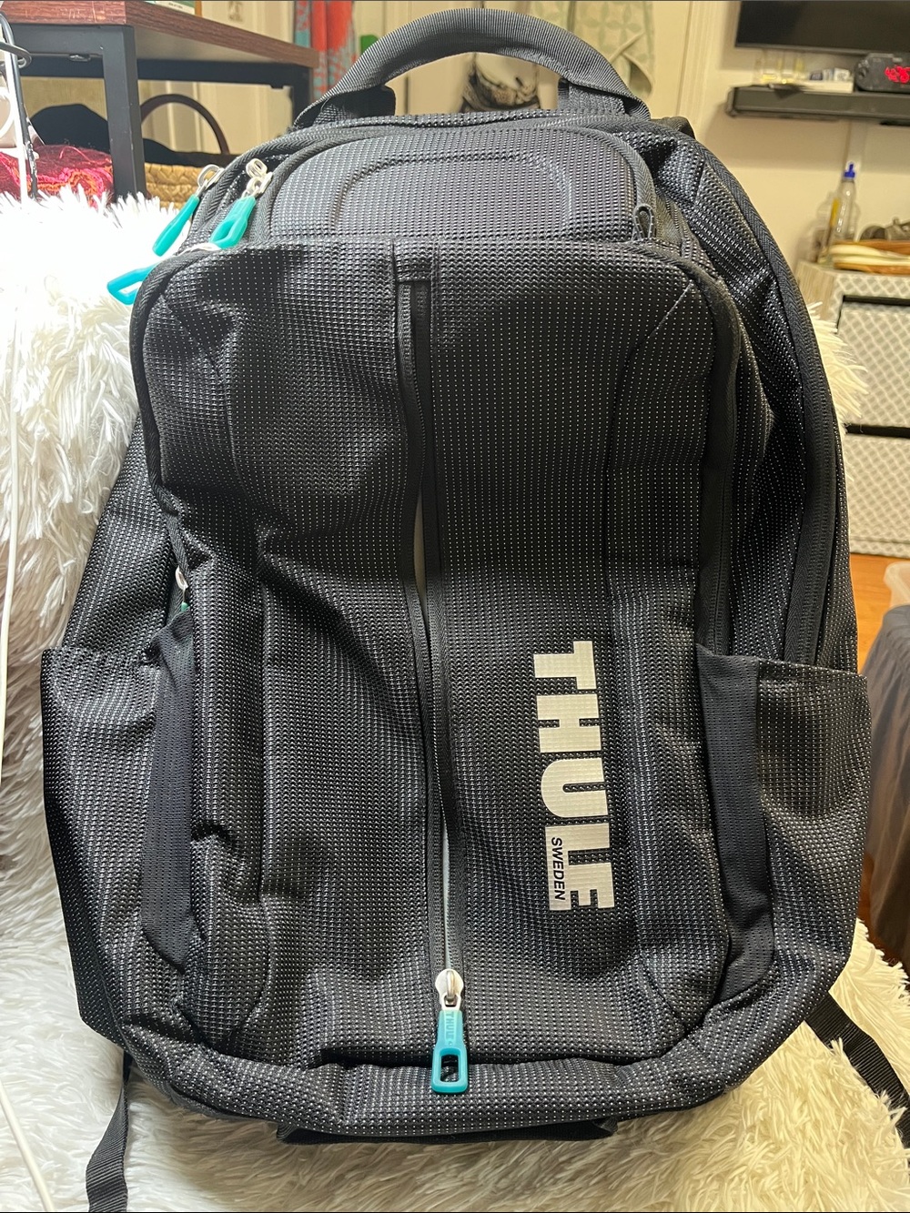 Thule Black Backpack with Teal Zipper Accents